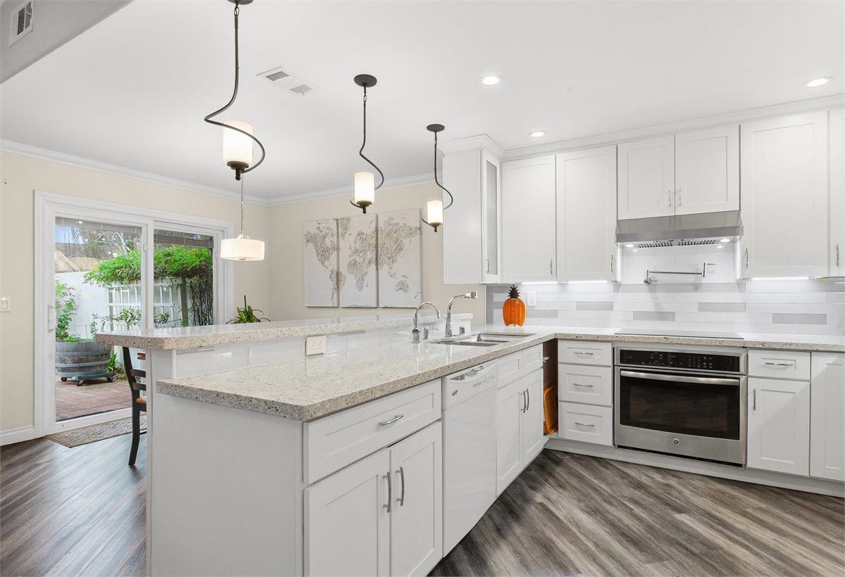 A gleaming white kitchen, deep cleaned and detailed to a show-ready standard