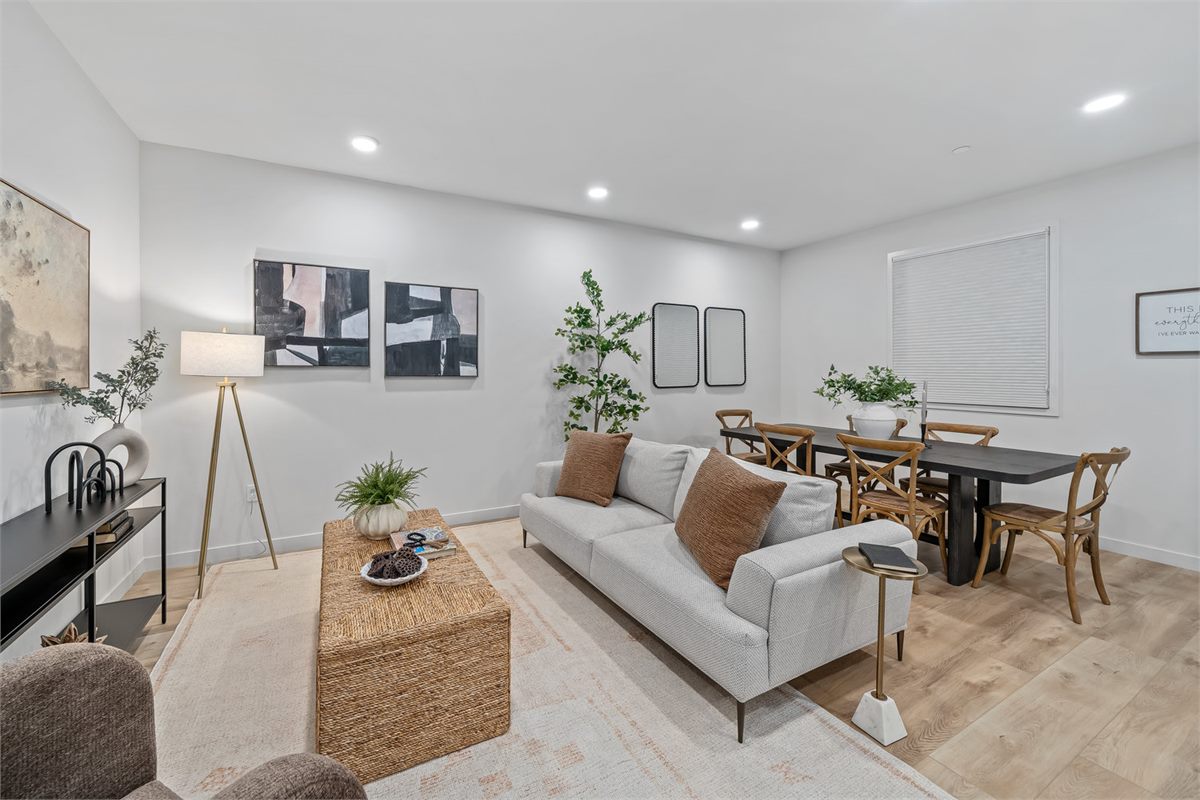 A bright, freshly staged living and dining room prepared for new occupants