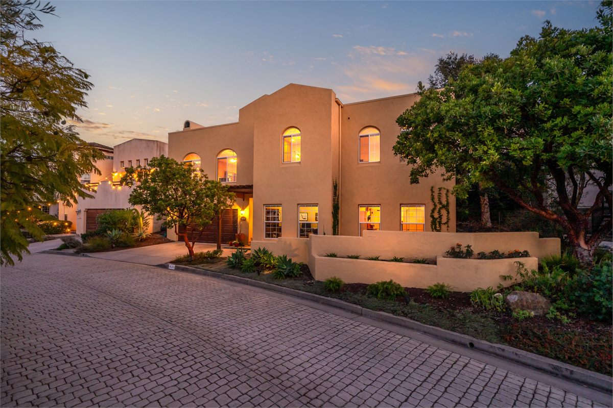 A Spanish-style home glowing at dusk, ready for its listing debut